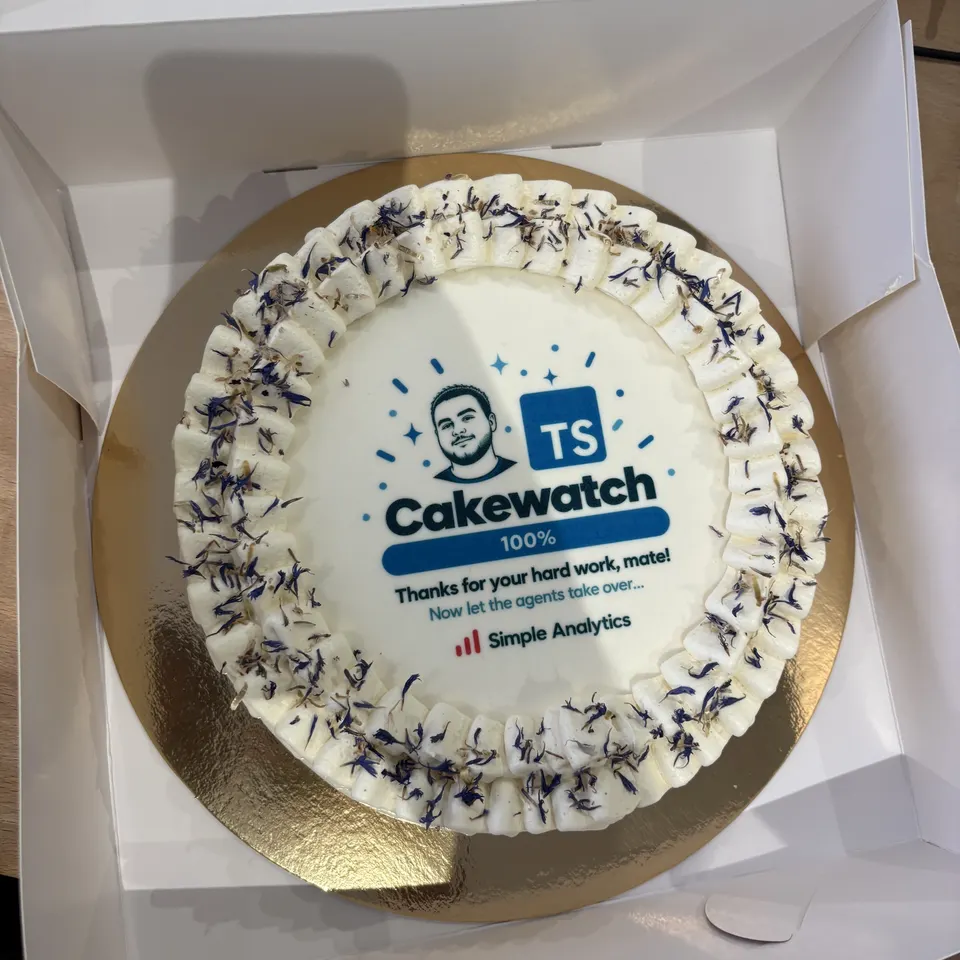 A cake for Alex that reads: Cakewatch, TypeScript 100%, thanks for your hard work, mate! Now let the agents take over.